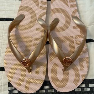 Michael Kors Coral/rose gold flip flops size 10